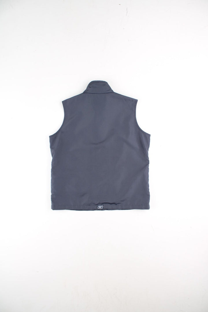 Y2K Reebok Vest Gilet in a grey colourway. Zips up and has side pockets, mesh lining, and the logo embroidered on the front and back.