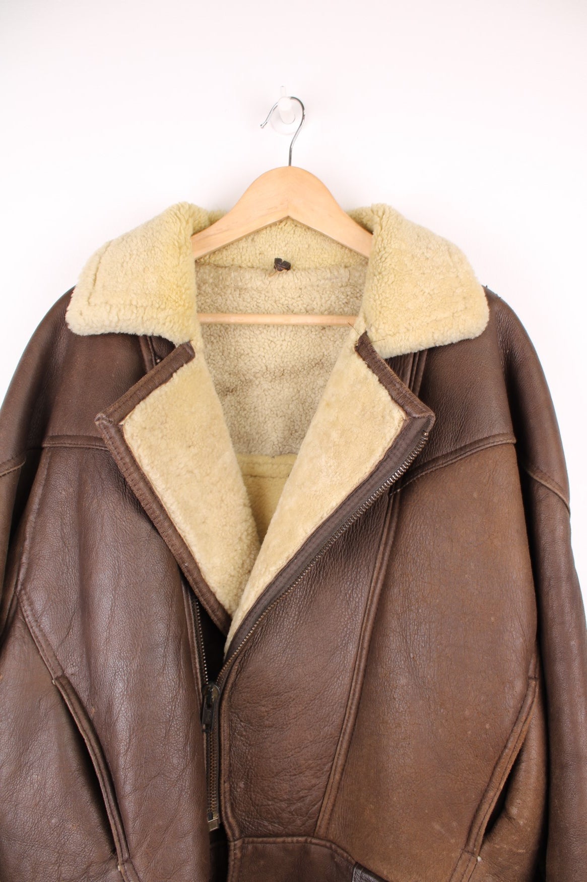 Vintage shearling aviator sheepskin jacket. Features buckle belt on the waist.