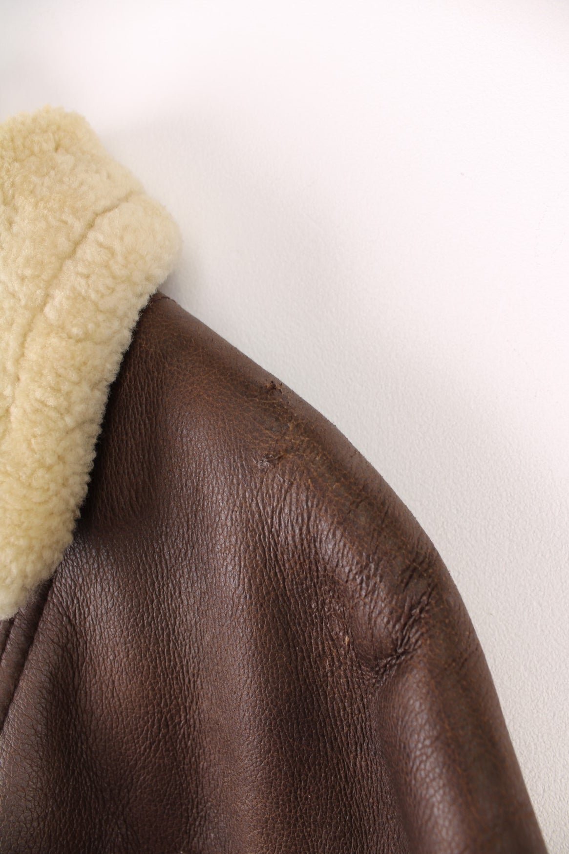 Vintage shearling aviator sheepskin jacket. Features buckle belt on the waist.