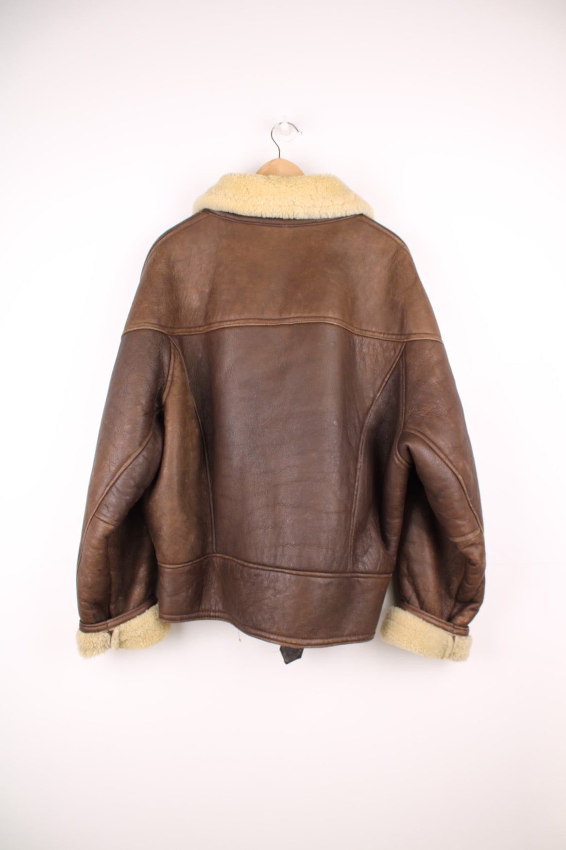 Vintage shearling aviator sheepskin jacket. Features buckle belt on the waist.