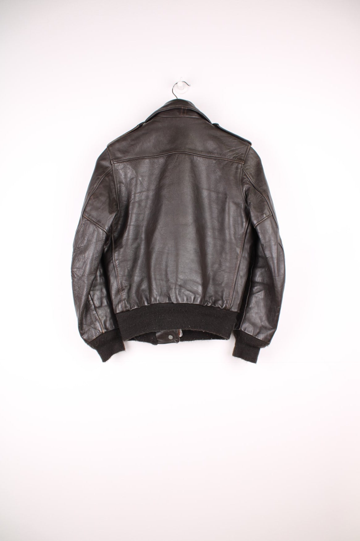 Vintage Schott brown leather flight jacket. Features zip and popper fastenings and double pockets.