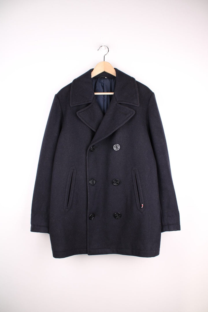  Marlboro Classics Jacket in a navy blue colourway. Traditional pea coat style, with anchor buttons, slash pockets and a hidden pocket in the interior lining. Made in Italy. 