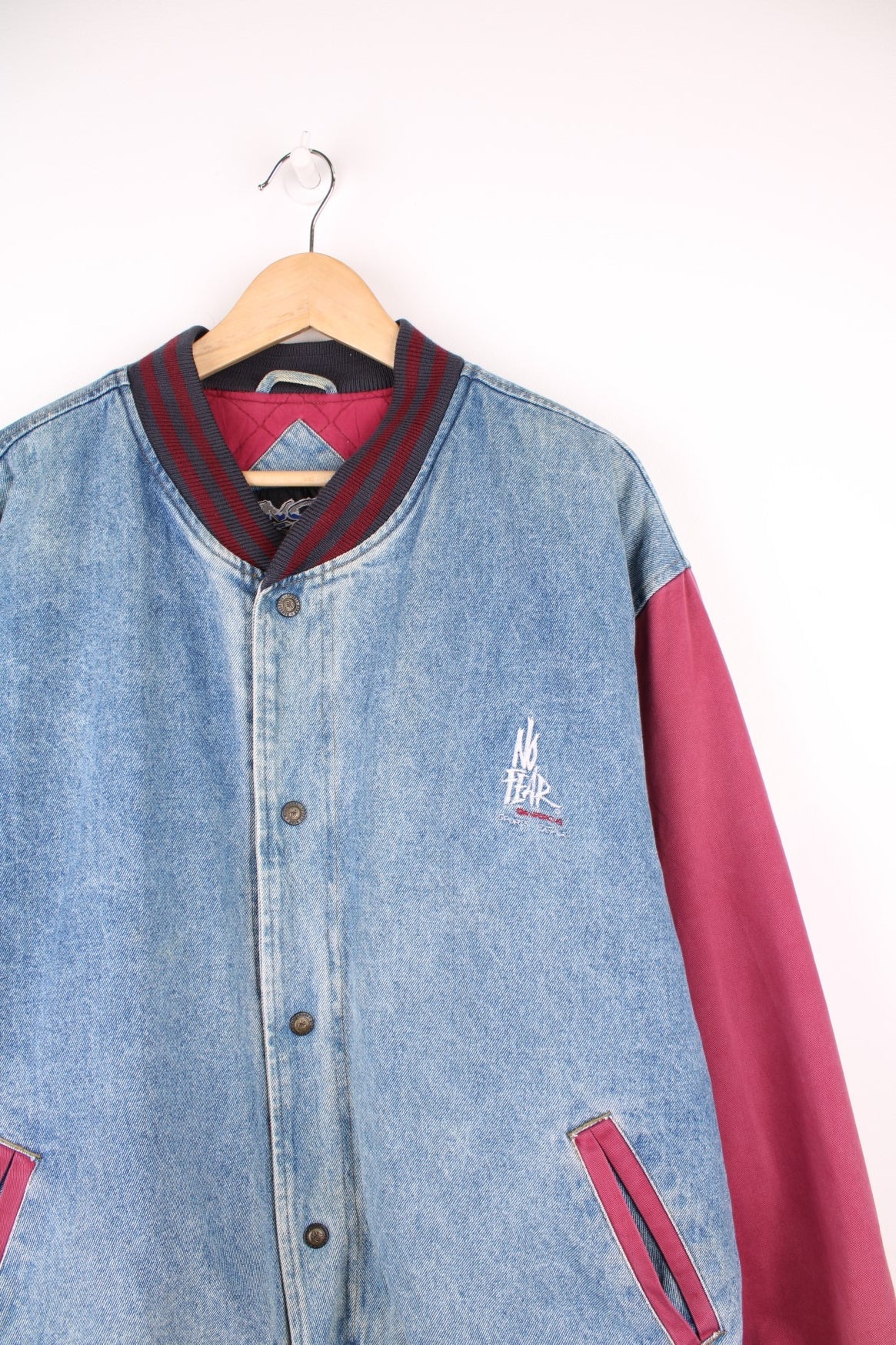 90s No Fear quilted denim varsity/bomber jacket in blue and burgundy red. Features embroidered logo on the chest. 