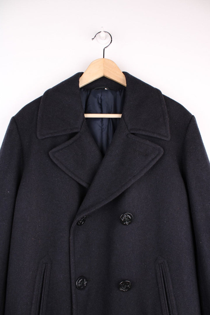  Marlboro Classics Jacket in a navy blue colourway. Traditional pea coat style, with anchor buttons, slash pockets and a hidden pocket in the interior lining. Made in Italy. 