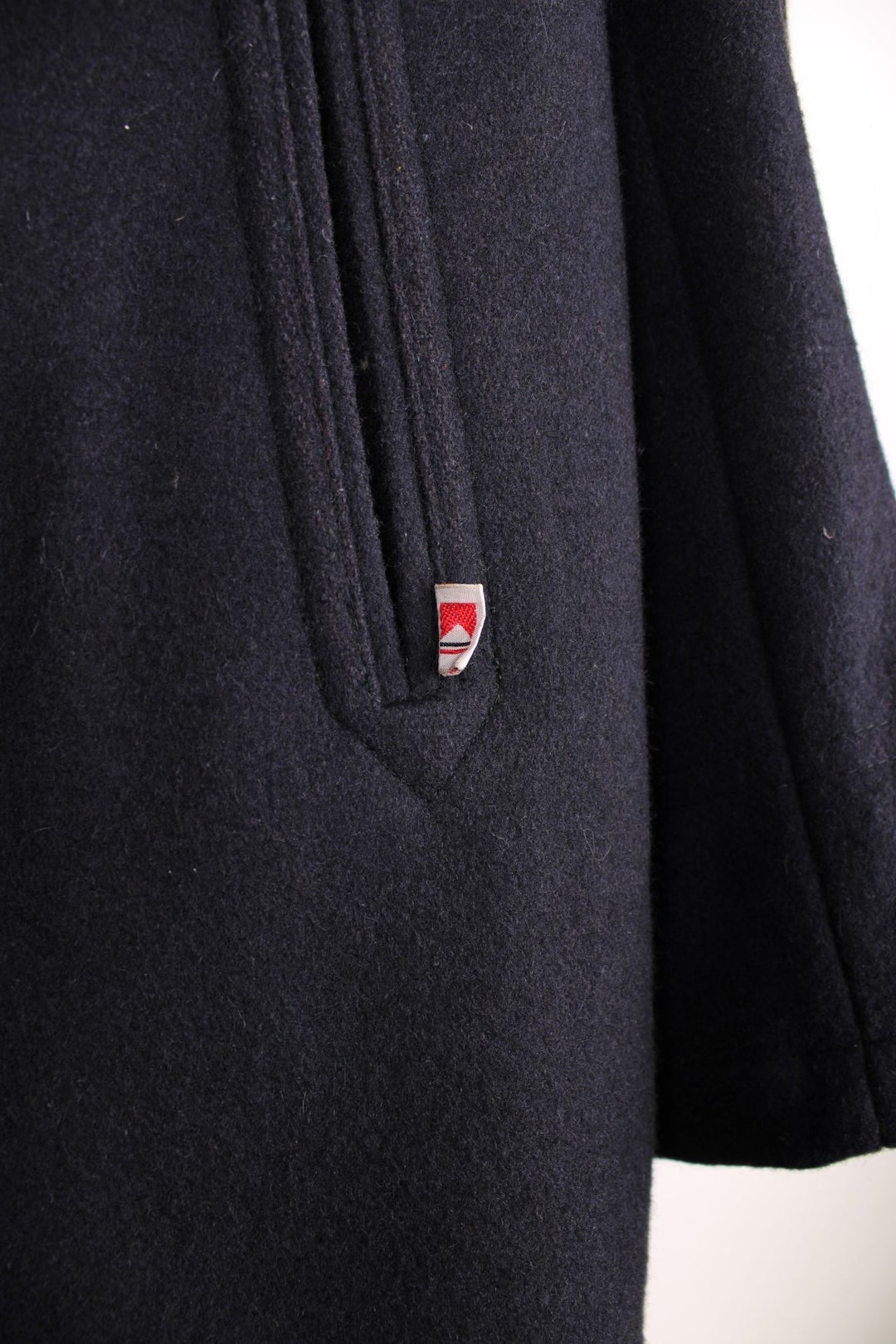  Marlboro Classics Jacket in a navy blue colourway. Traditional pea coat style, with anchor buttons, slash pockets and a hidden pocket in the interior lining. Made in Italy. 