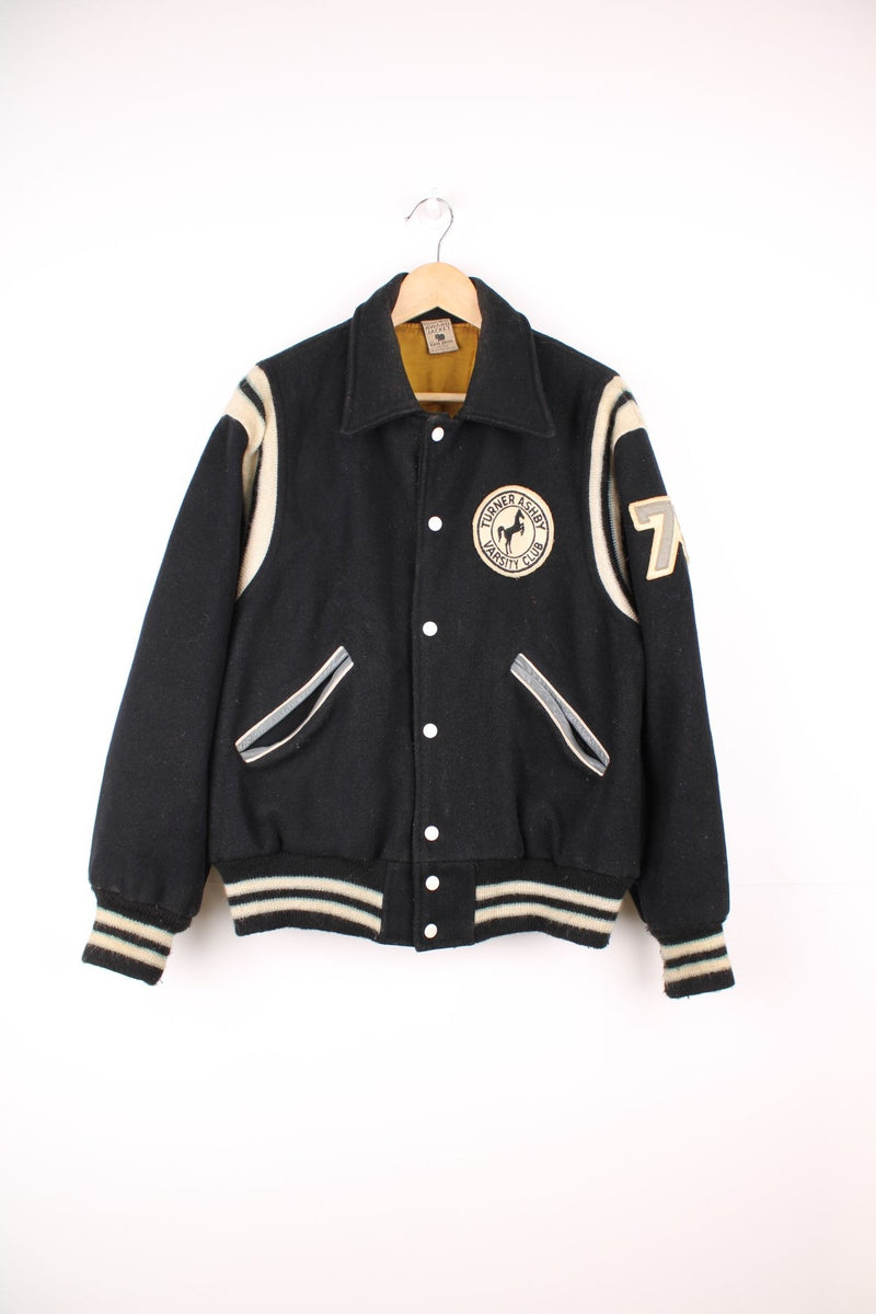 Vintage 70s Kaye Bros Award Jacket/Varsity jacket in black with white detailing. Features embroidered Turner Ashby Varsity Club patch on the chest.