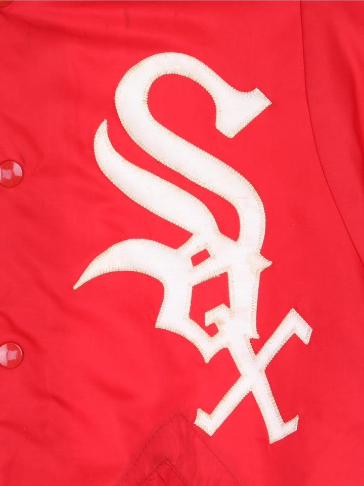 Vintage 1970s Wilson Chicago White Sox bomber jacket in a red colourway. The jacket has a large embroidered Red Sox Logo on the front. striped elasticated cuffs and hem, and two jetted pockets. Made in the USA. 