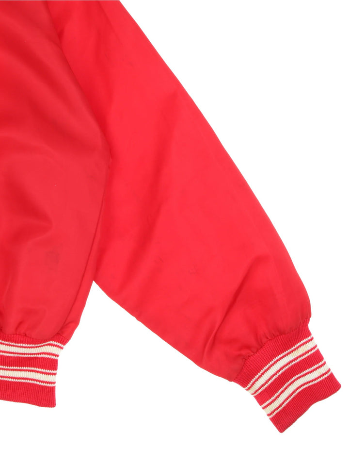 Vintage 1970s Wilson Chicago White Sox bomber jacket in a red colourway. The jacket has a large embroidered Red Sox Logo on the front. striped elasticated cuffs and hem, and two jetted pockets. Made in the USA. 