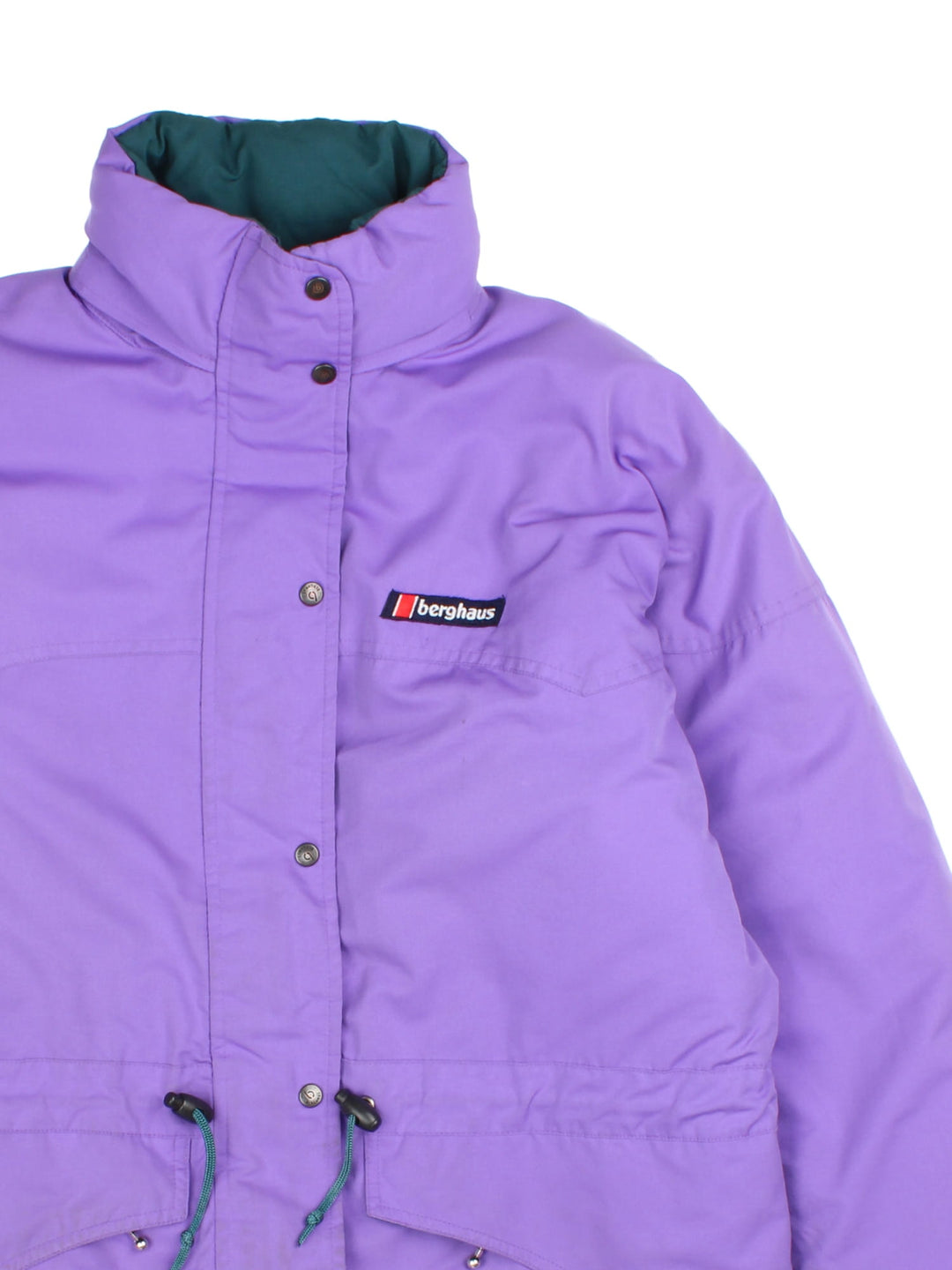 Vintage 1990s Berghaus Coat in a purple colourway. The jacket has two front pockets and one interior, a toggle to pull in the waist and a fold away hood.