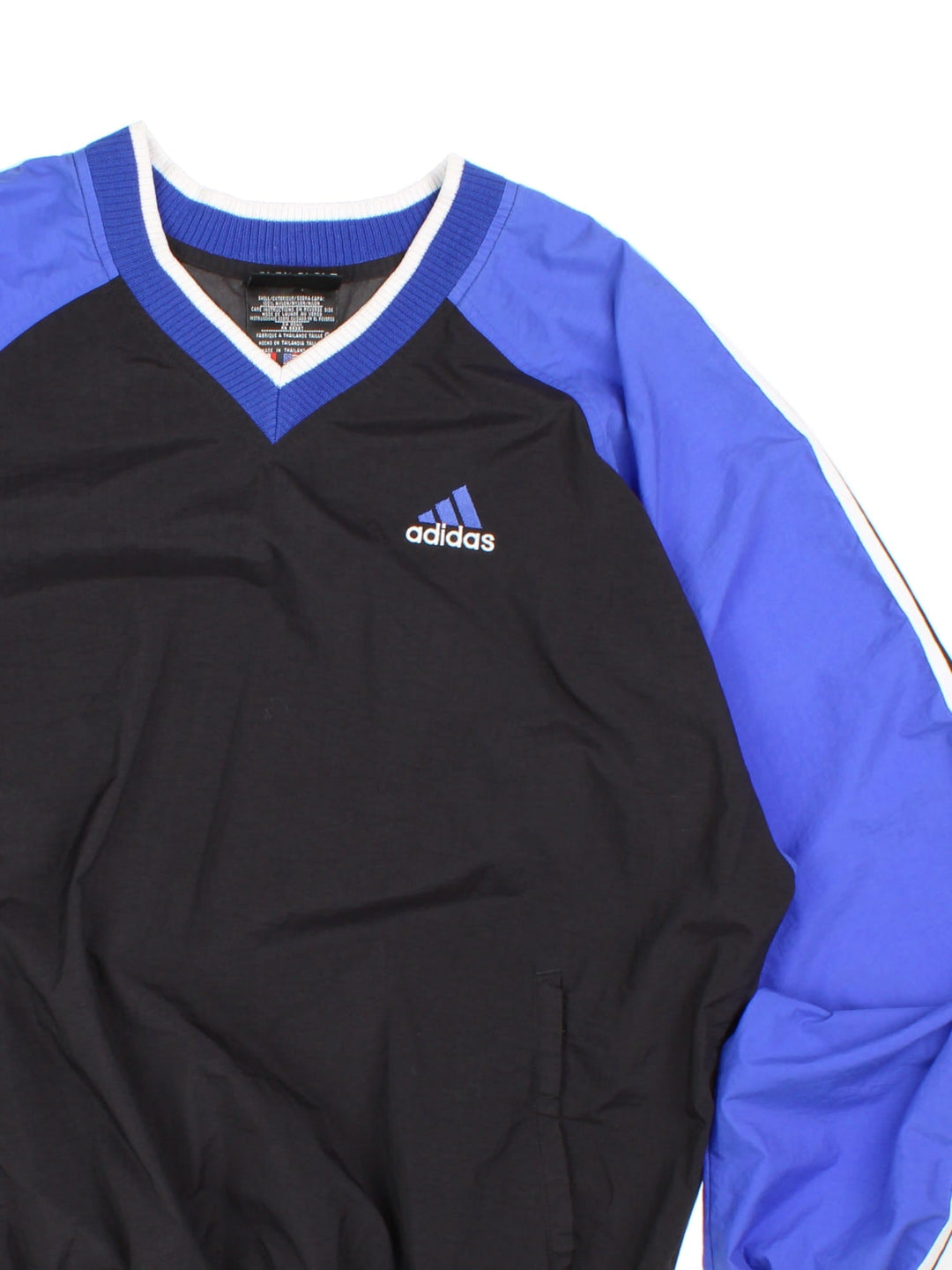 Vintage 1990s Adidas drill top in a black and blue colourway. The top has the traditional 3 stripes down the sleeves and an embroidered logo on the front. 