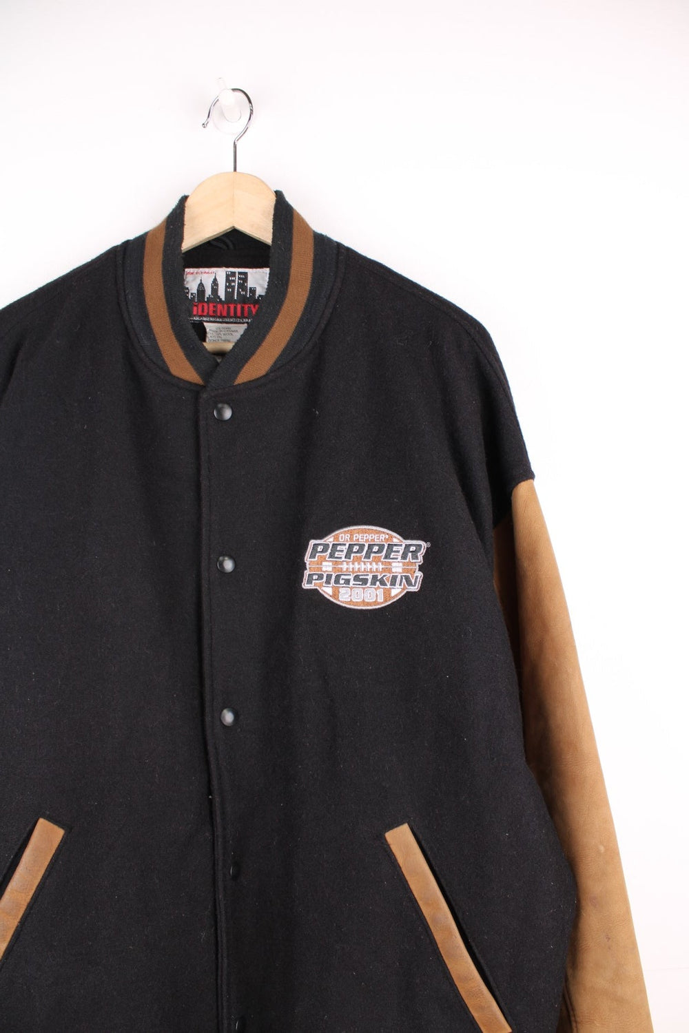 Vintage 2001 Dr Pepper, Pepper Pigskin black and brown leather varsity jacket by Identity. Features embroidered badge on the chest and popper fastenings. 