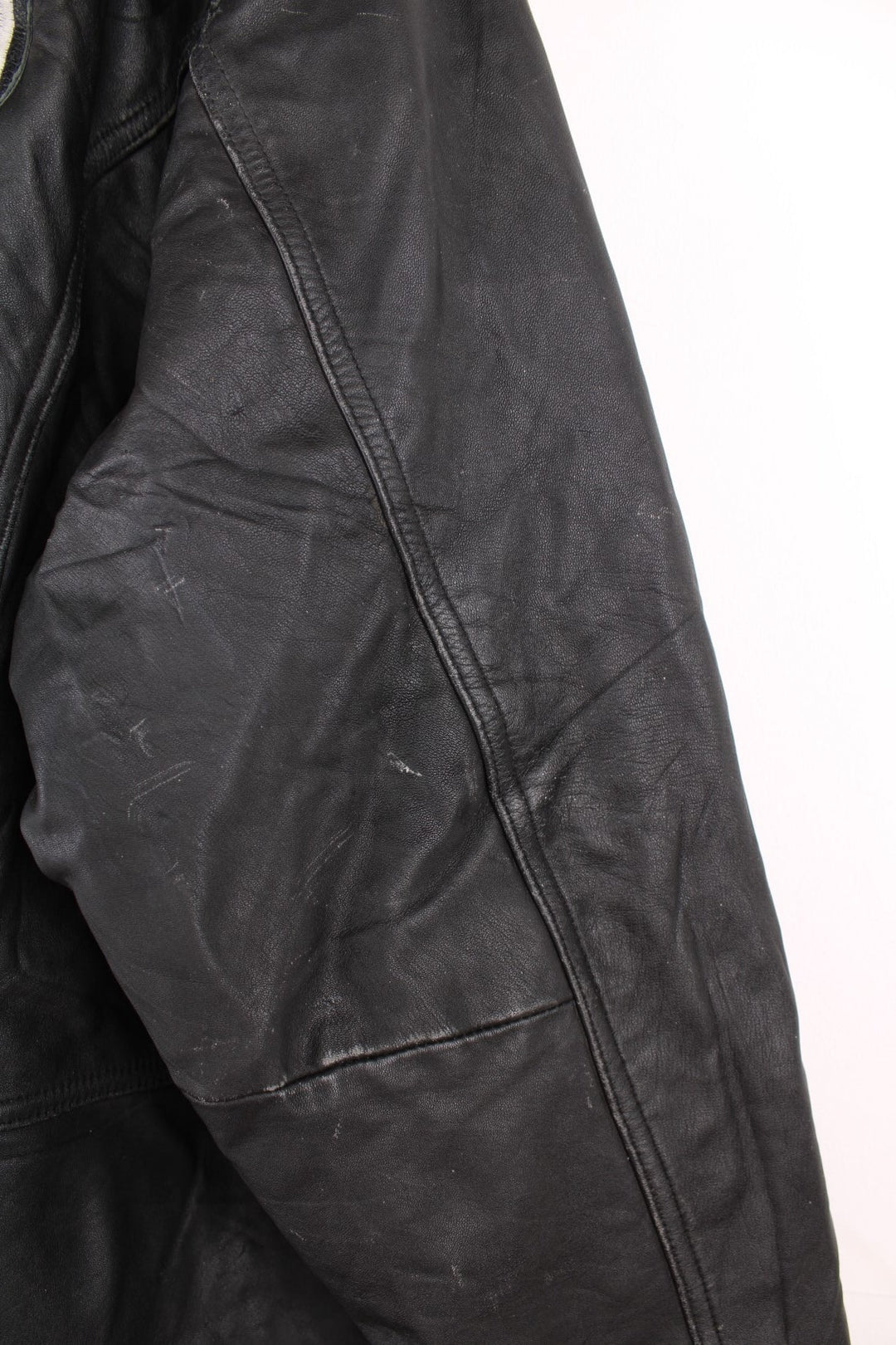 Vintage Oakland Raiders collared zip through leather jacket. Features embroidered badge on the front and back. 