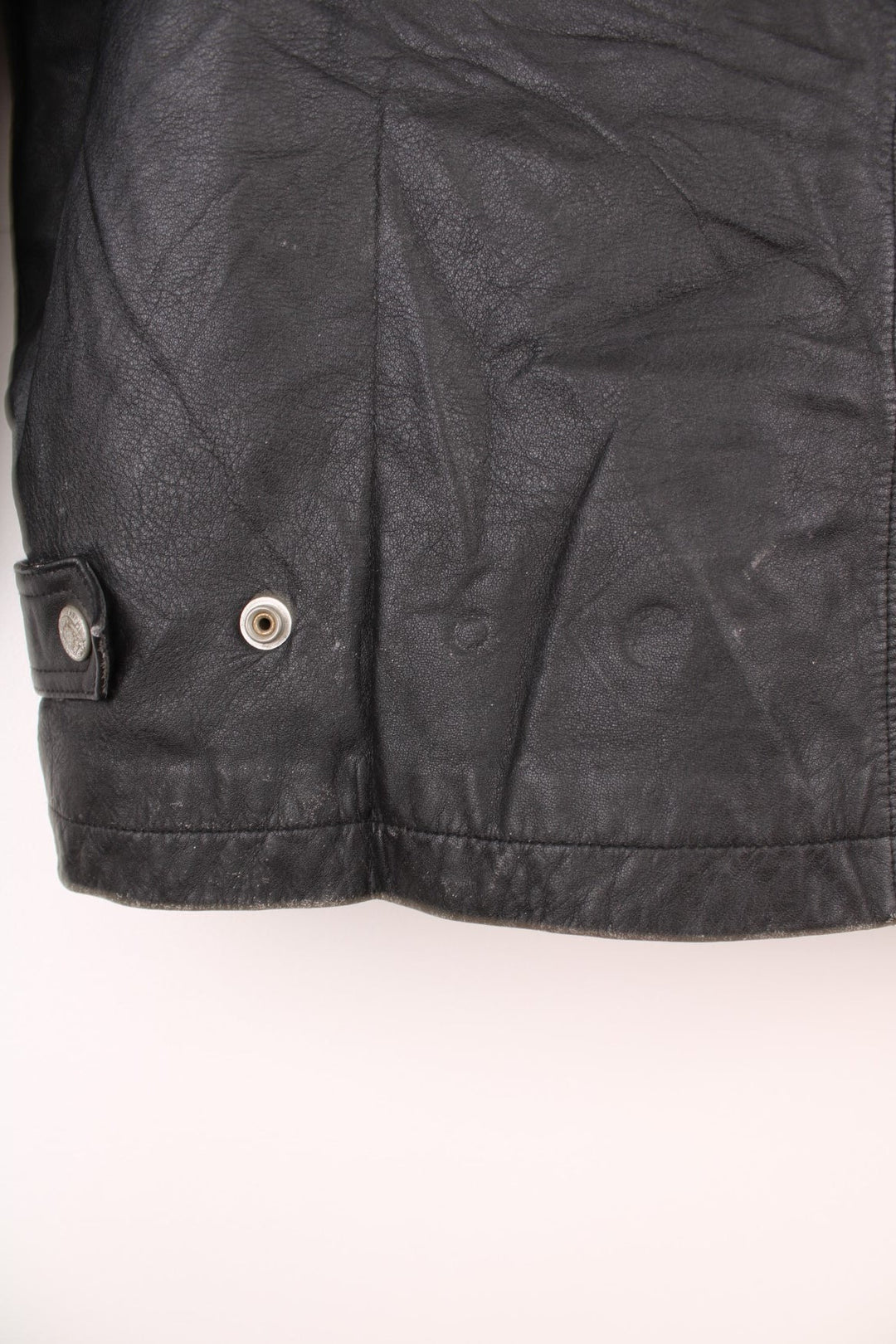 Vintage Oakland Raiders collared zip through leather jacket. Features embroidered badge on the front and back. 