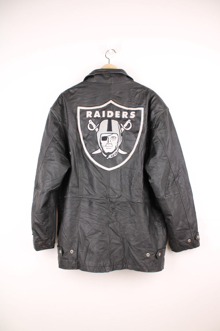 Vintage Oakland Raiders collared zip through leather jacket. Features embroidered badge on the front and back. 