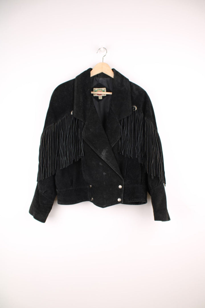 Vintage 70s Rock Creek fringe suede jacket. Features popper fastenings and silver hardwear across the top of the tassles.