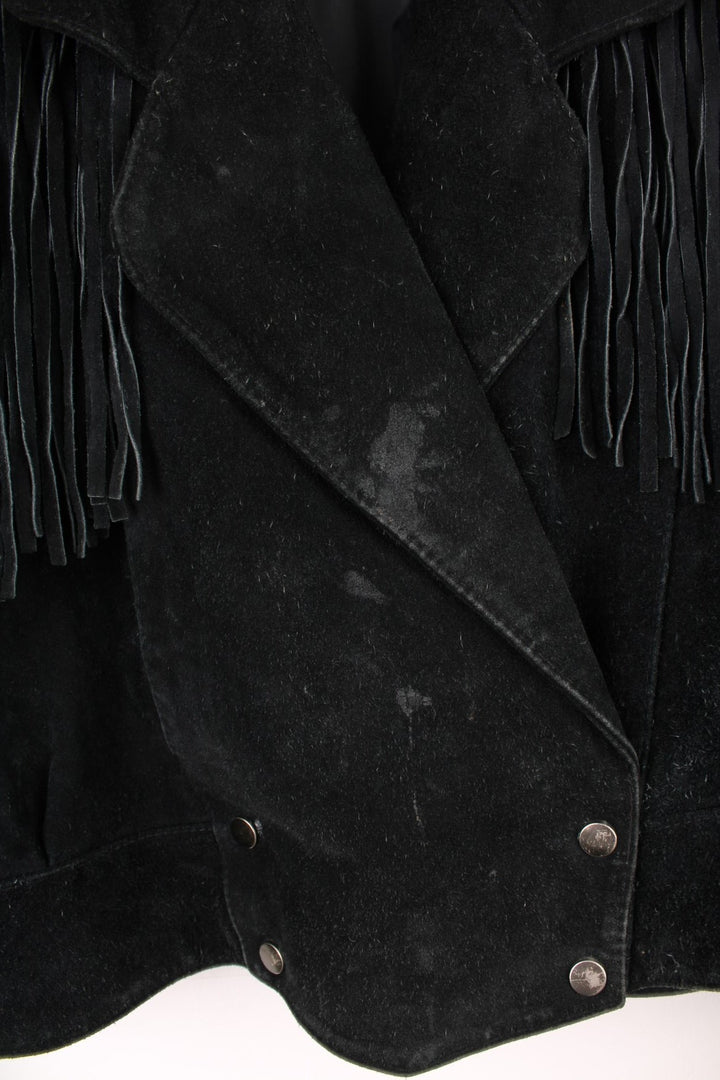 Vintage 70s Rock Creek fringe suede jacket. Features popper fastenings and silver hardwear across the top of the tassles.