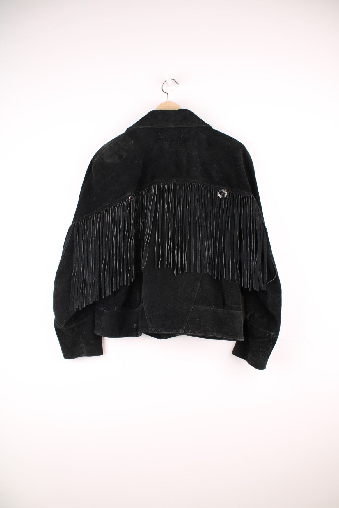 Vintage 70s Rock Creek fringe suede jacket. Features popper fastenings and silver hardwear across the top of the tassles.