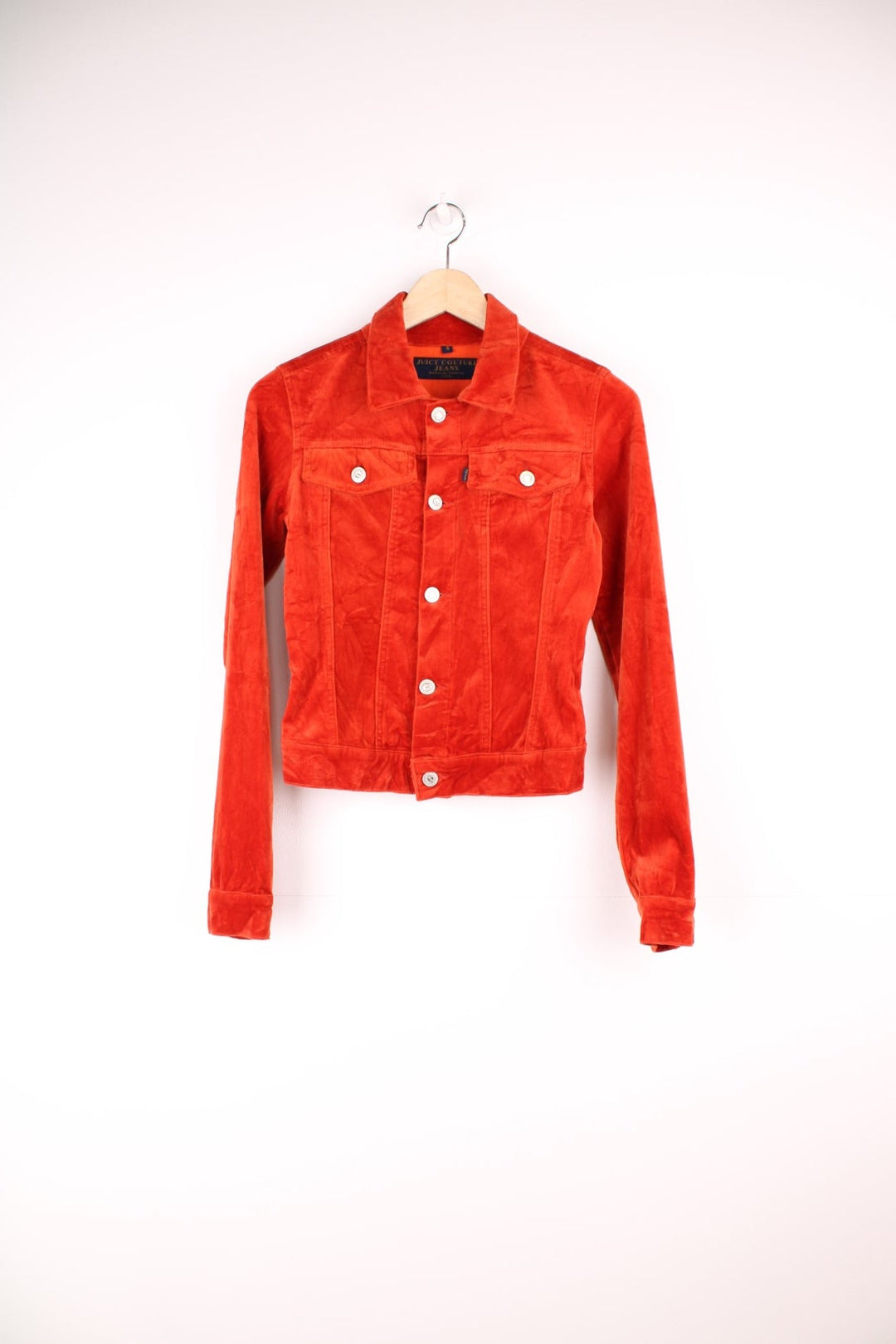 Vintage Y2K Juicy Couture fitted velour button through jacket in burnt orange. Features chest pockets, blue tab spell out logo and embellished "Juicy Couture" silver buttons.