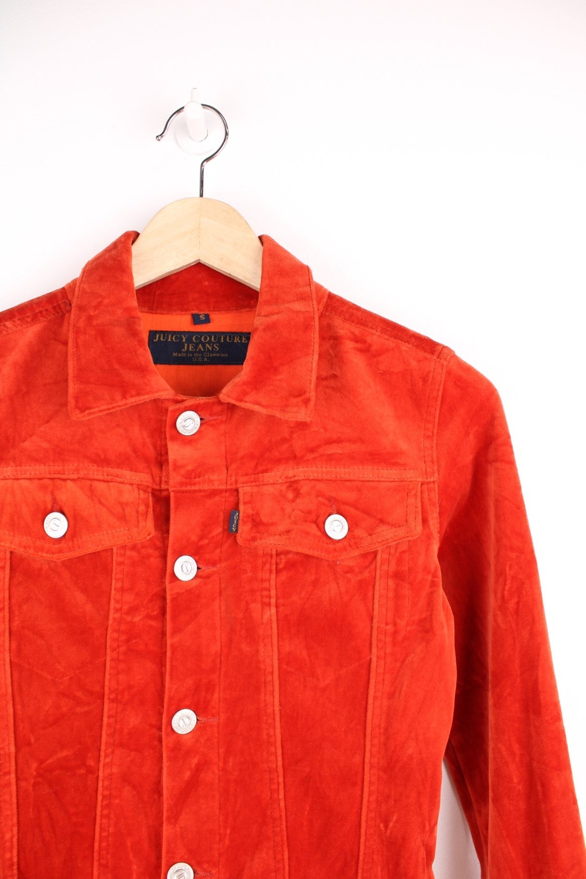 Vintage Y2K Juicy Couture fitted velour button through jacket in burnt orange. Features chest pockets, blue tab spell out logo and embellished "Juicy Couture" silver buttons.