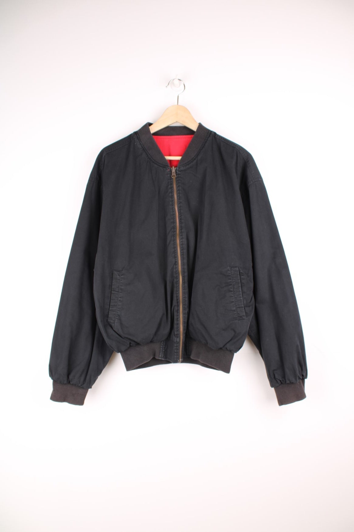 Vintage Marlboro reversible bomber jacket in red and black. Features embroidered spell out logo on the back, and embroidered "M" on the sleeve. 