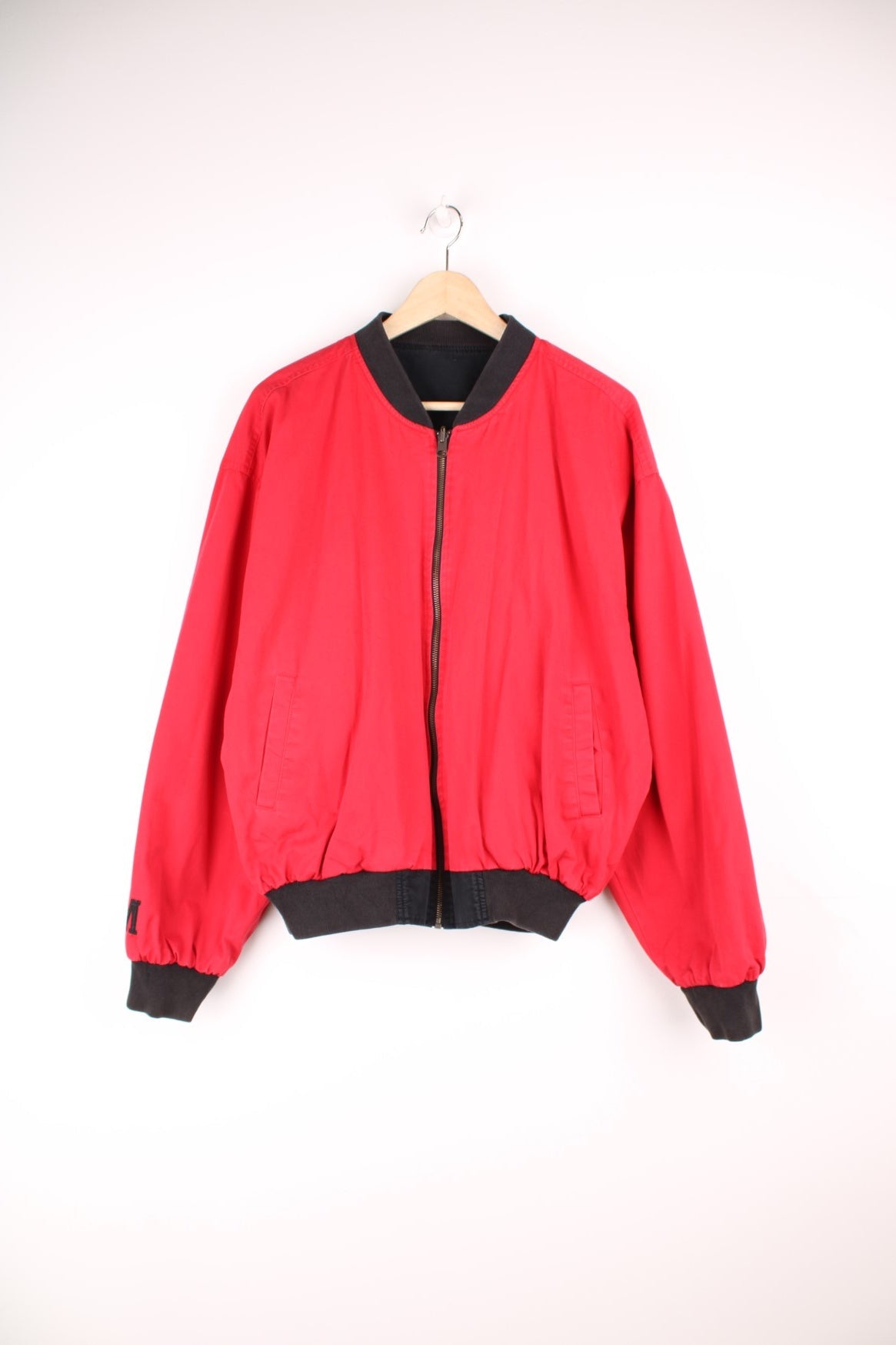 Vintage Marlboro reversible bomber jacket in red and black. Features embroidered spell out logo on the back, and embroidered "M" on the sleeve. 