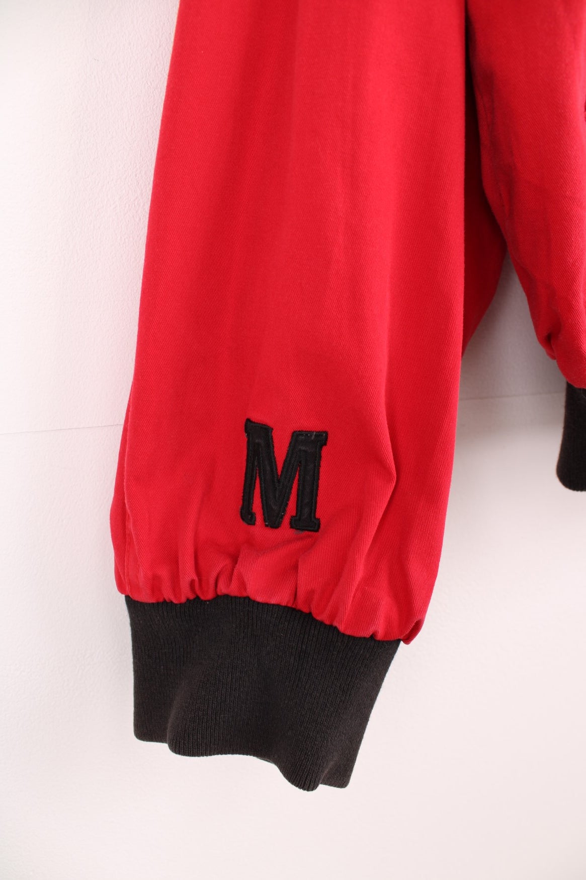 Vintage Marlboro reversible bomber jacket in red and black. Features embroidered spell out logo on the back, and embroidered "M" on the sleeve. 