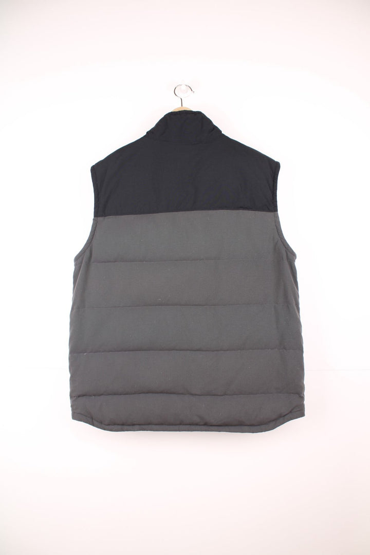 Grey and black Patagonia puffer gilet with zip and snap closure and slit pockets. 