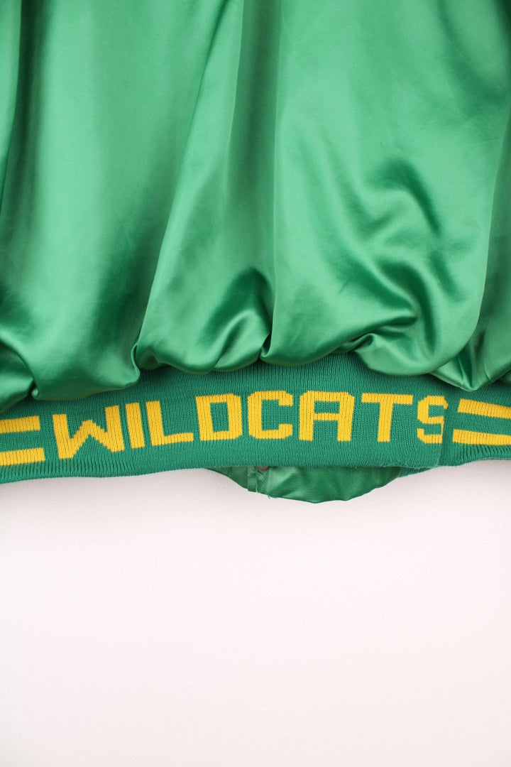 Green and yellow Pineland Wildcats bomber jacket with snap closure and side pockets.