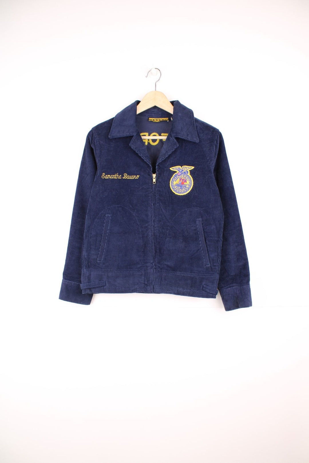 1980s FFA Agricultural Education, Escalon, California navy blue corduroy jacket with FFA crest on front and back, and the name 'Samantha Bavaro' embroidered. With zip closure and two slit side pockets. 