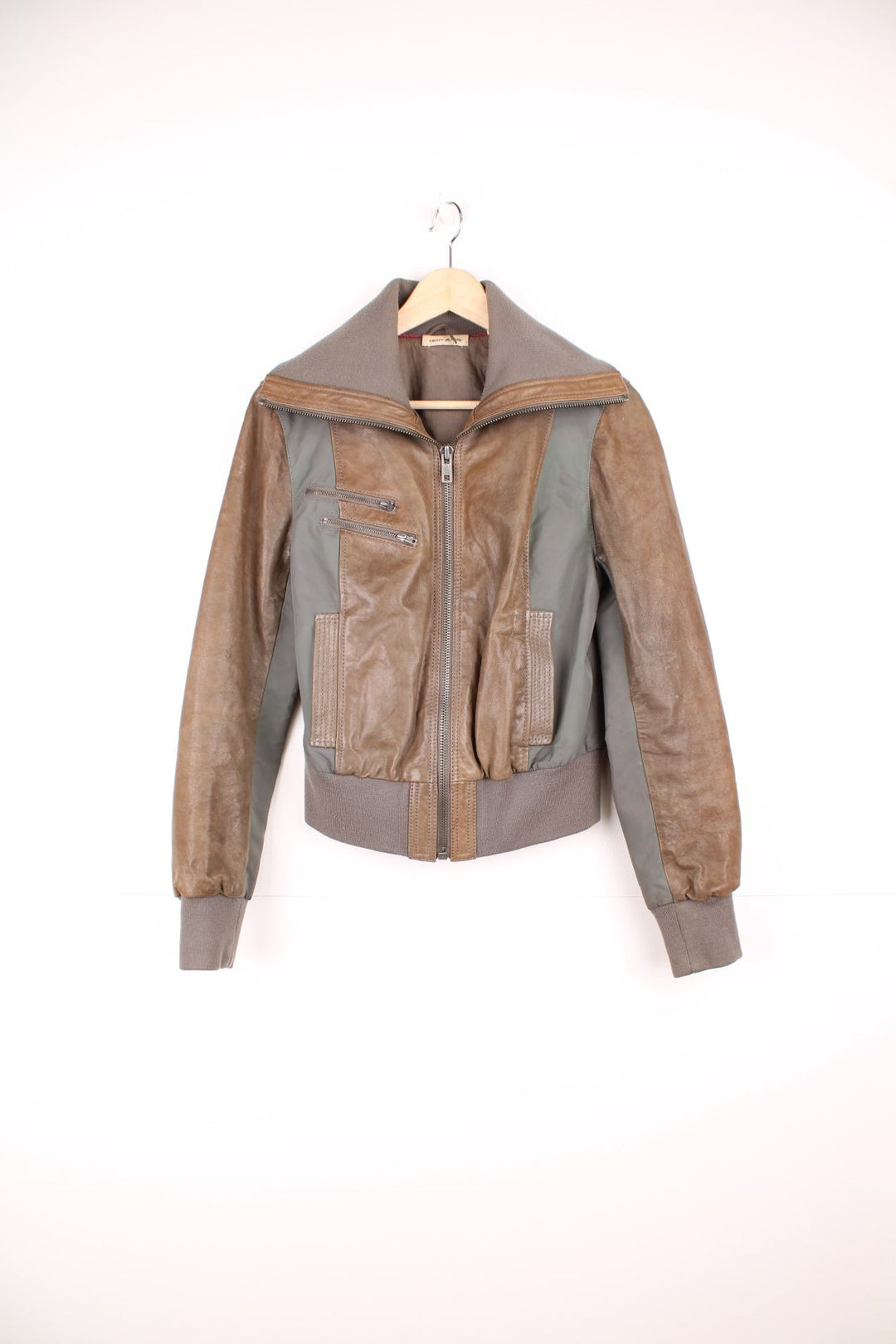 DKNY brown and grey panelled leather bomber jacket with zip closure and four pockets.  