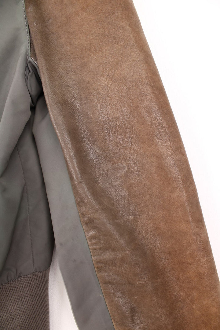 DKNY brown and grey panelled leather bomber jacket with zip closure and four pockets.  