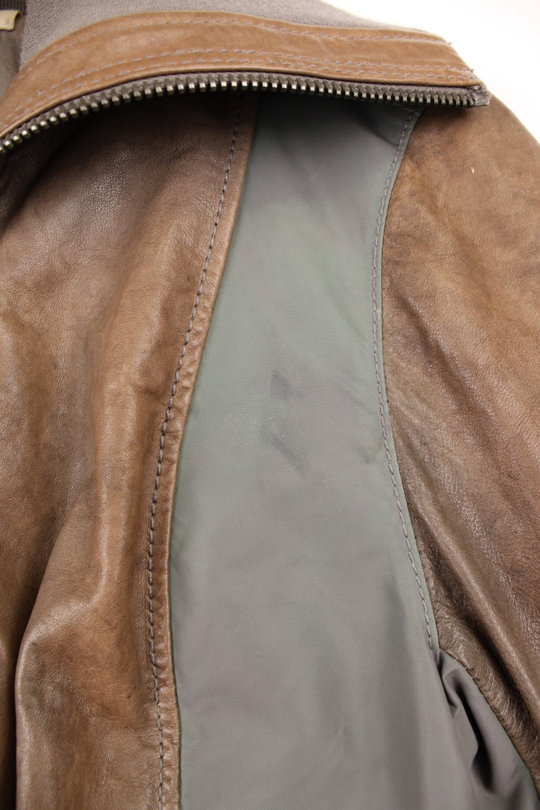 DKNY brown and grey panelled leather bomber jacket with zip closure and four pockets.  