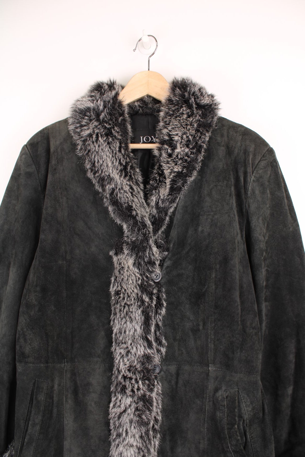 JOY Afghan coat in black suede with faux fur trim, button closure and two side pockets. 