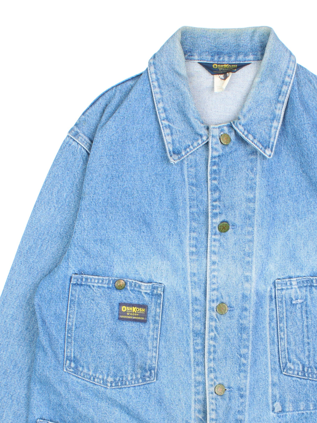 Vintage OshKosh B'Gosh Workwear denim Jacket in a blue colourway. Buttons up with 4 patch pockets, Osh Kosh patch logo on front.