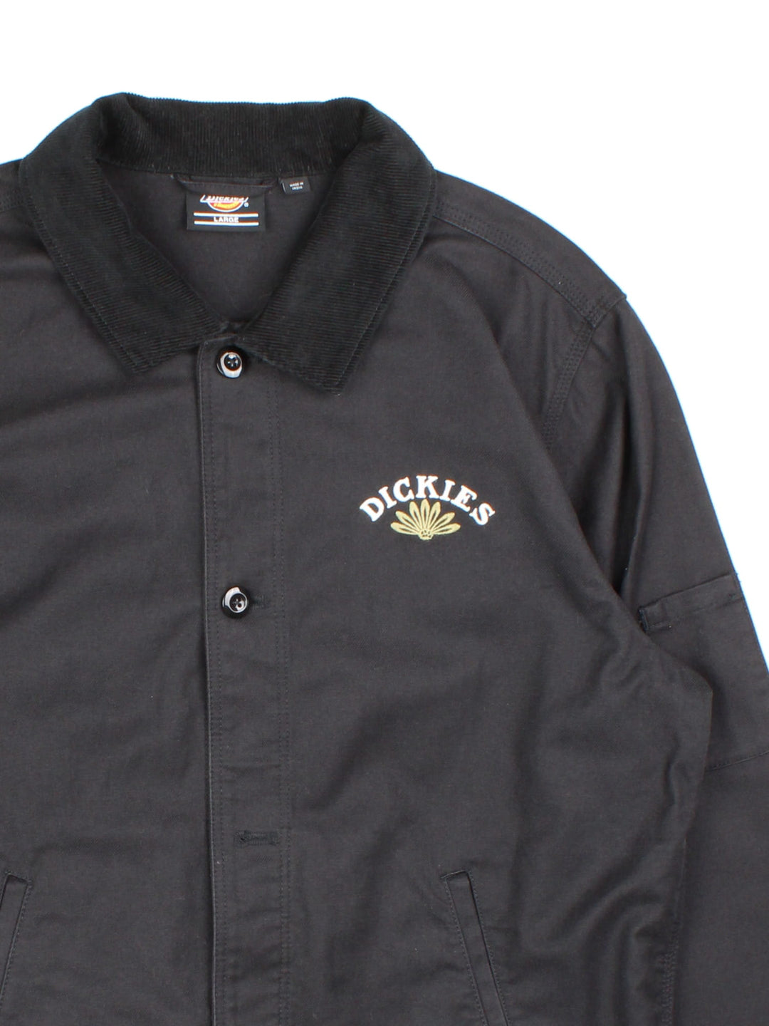 Vintage Dickies x Fort Lewis Embroidered Jacket in a black colourway. Buttons up, with side pockets and corduroy detail collar. Embroided branding on front and back.