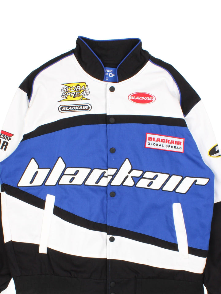 Vintage Blackair Nascar Jacket in a white, blue and black colourway. Buttons up and has side pockets, and all over embroidered logo detailing.