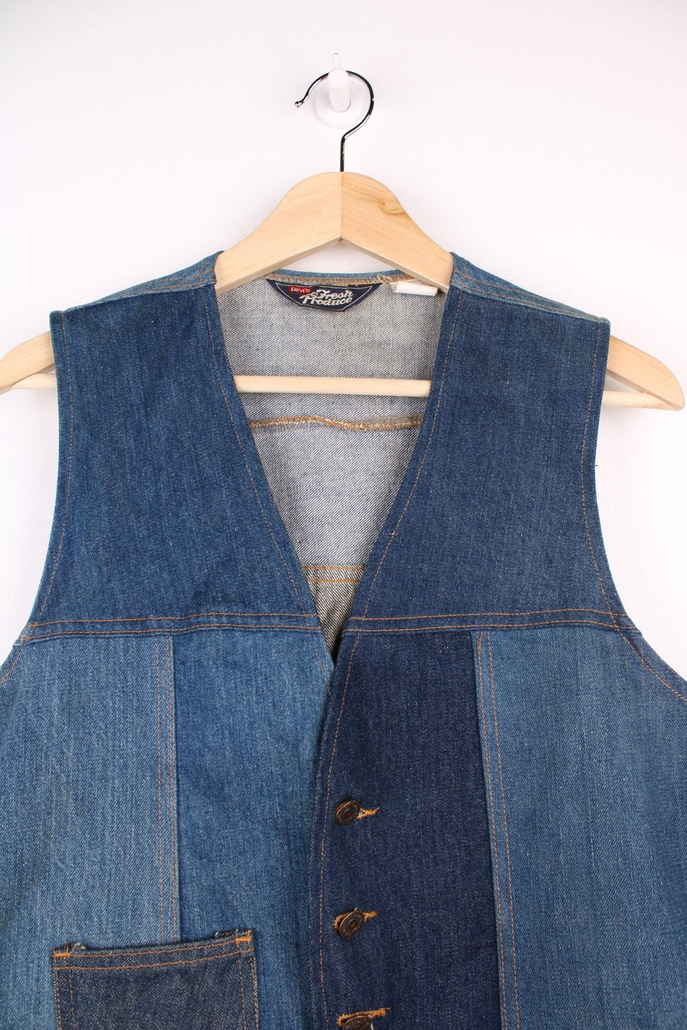 Vintage Levi Strauss waistcoat in a mixed denim blue colourway. The waistcoat was made in the 1970s and is part of a Levi's line Fresh Produce. It has a small patch pocket on the front, and a waist fastener on the back. Made in the USA. 