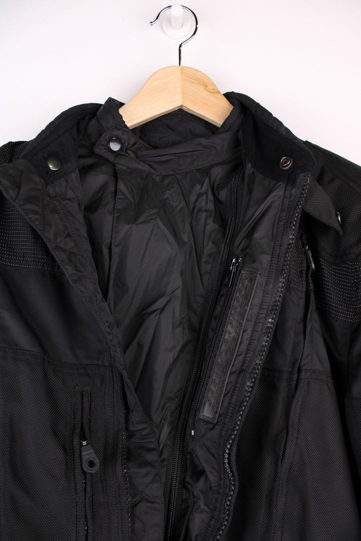 Vintage Harley-Davidson motorcycle jacket in a black colourway. The jacket has a removable lining, protective padding on the elbows and shoulders and multiple exterior and interior pockets.  