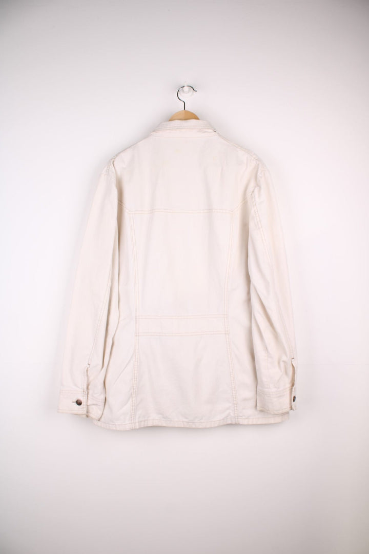 Vintage Levi Strauss chore jacket in an off white / cream colourway. Has a dagger collar and two zip pockets. Made in the USA. 