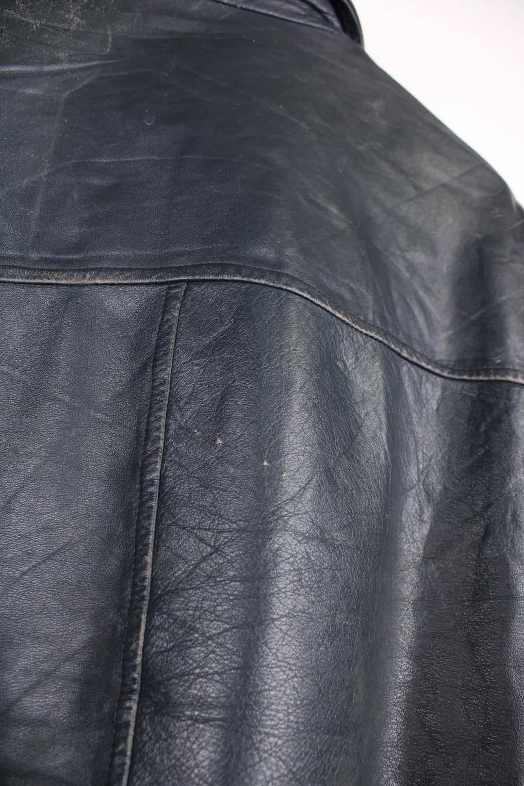 Vintage leather jacket in a dark navy blue colourway. The jacket has an Orillia Travelways patch, who were an Ice Hockey team based in Ontario Canada. It also has press studs to close, and jetted pockets on the front. Dates between 1970-78. Made in Canada. 