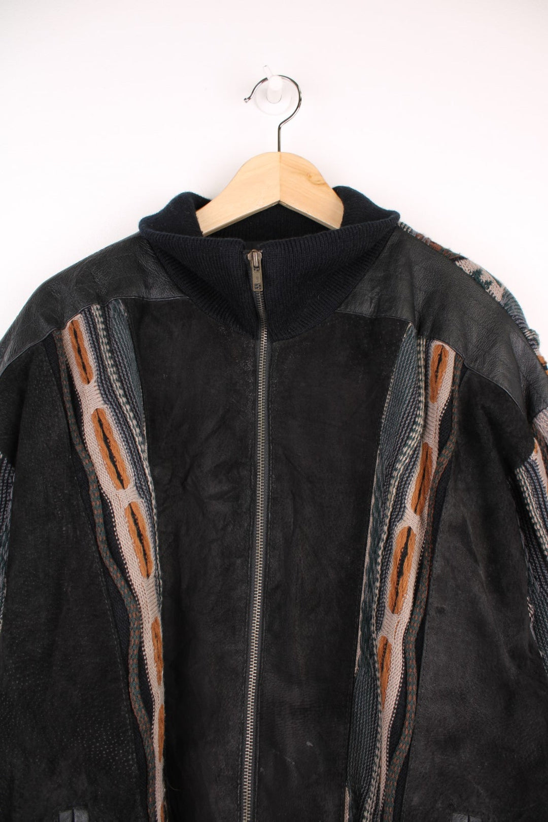 Vintage Pagani knitted and suede bomber jacket, in a black and brown colourway. The jacket has suede panels on the front, leather patches on the shoulders and 3D knit sleeves and back panels.  