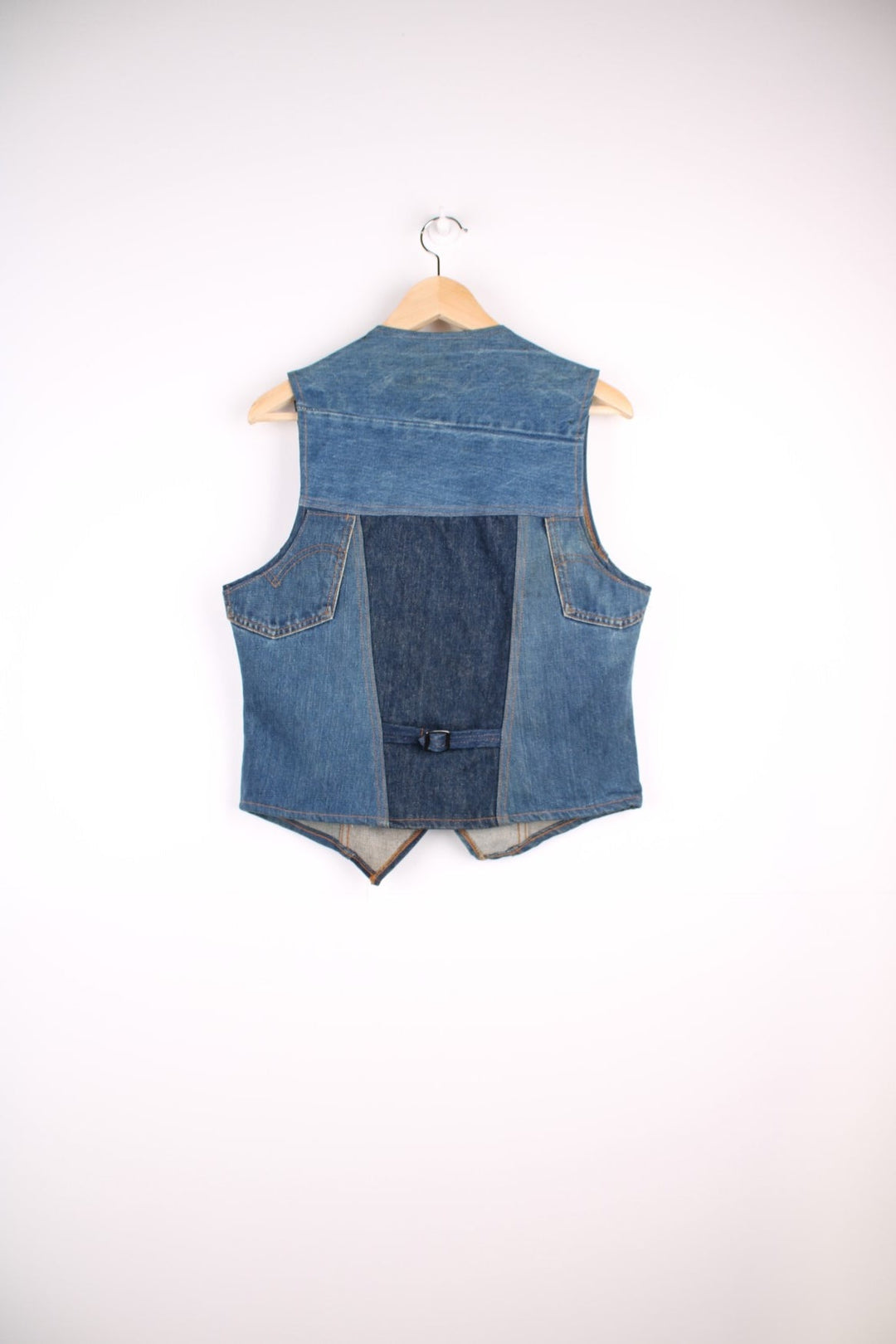 Vintage Levi Strauss waistcoat in a mixed denim blue colourway. The waistcoat was made in the 1970s and is part of a Levi's line Fresh Produce. It has a small patch pocket on the front, and a waist fastener on the back. Made in the USA. 