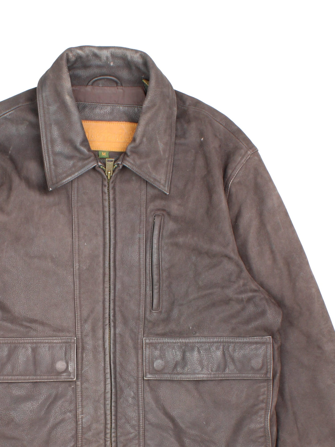 Timberland leather jacket in brown with multiple pockets, zip closure, and ribbed collar and cuffs.