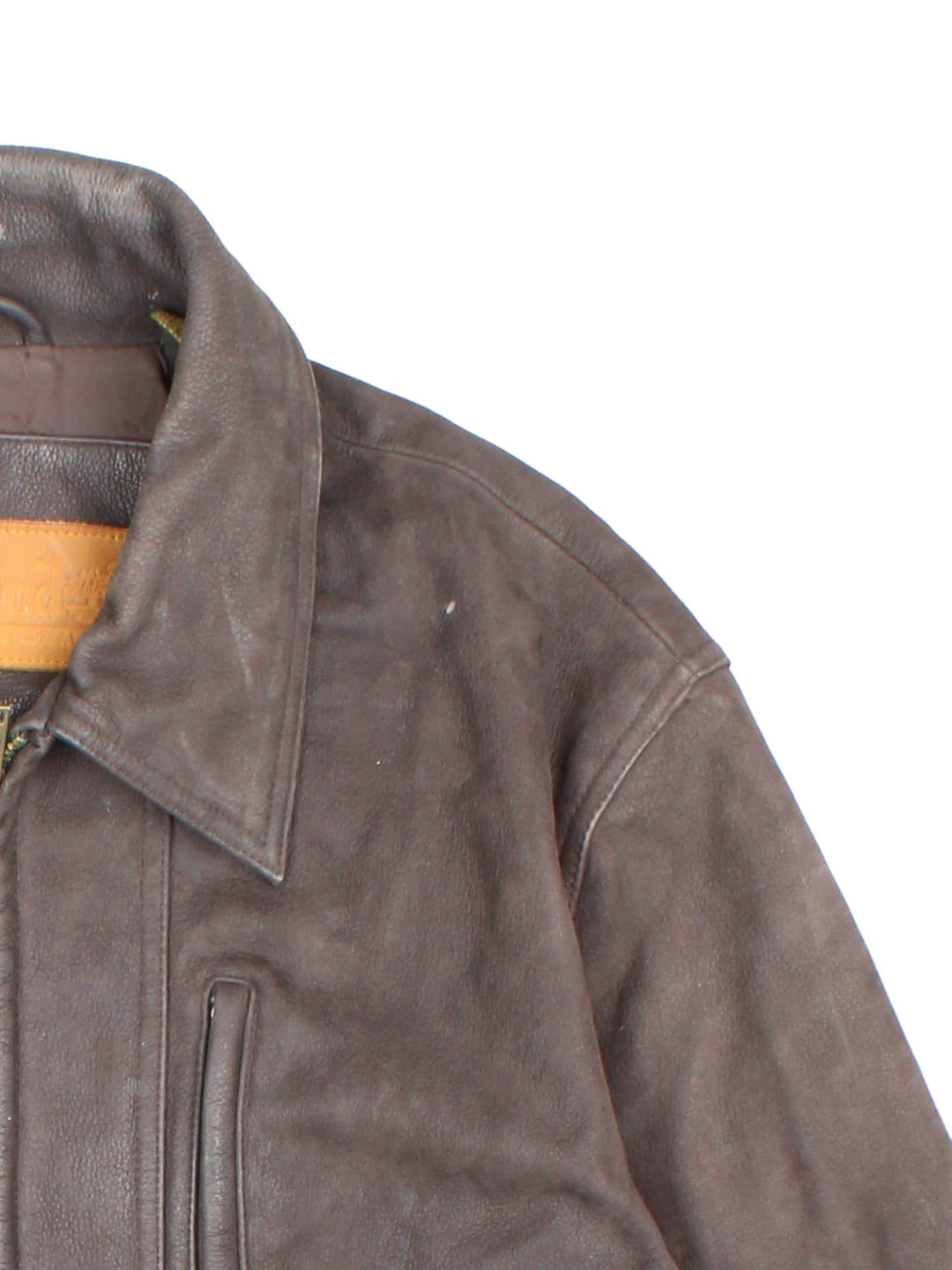 Timberland leather jacket in brown with multiple pockets, zip closure, and ribbed collar and cuffs.