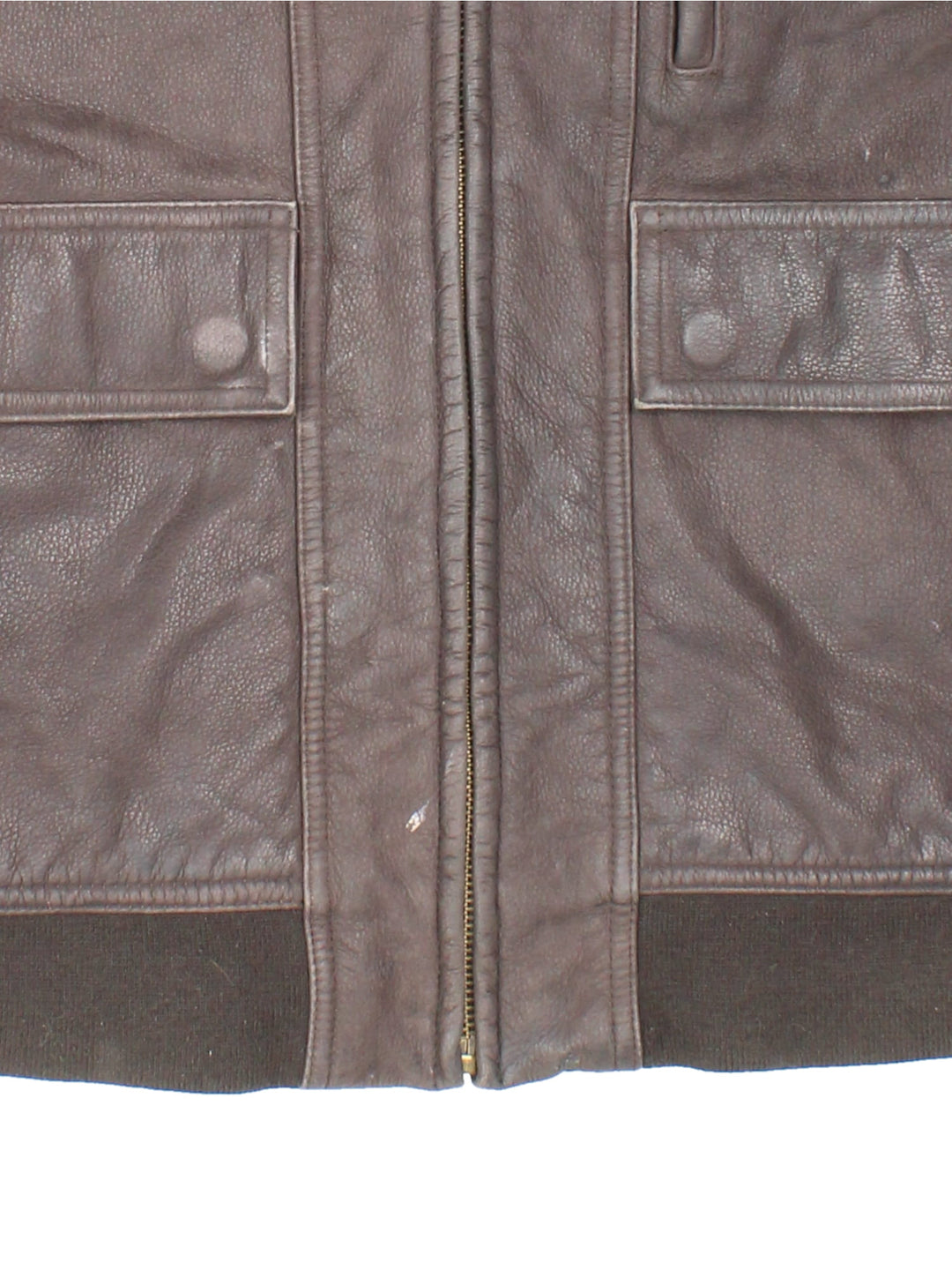 Timberland leather jacket in brown with multiple pockets, zip closure, and ribbed collar and cuffs.