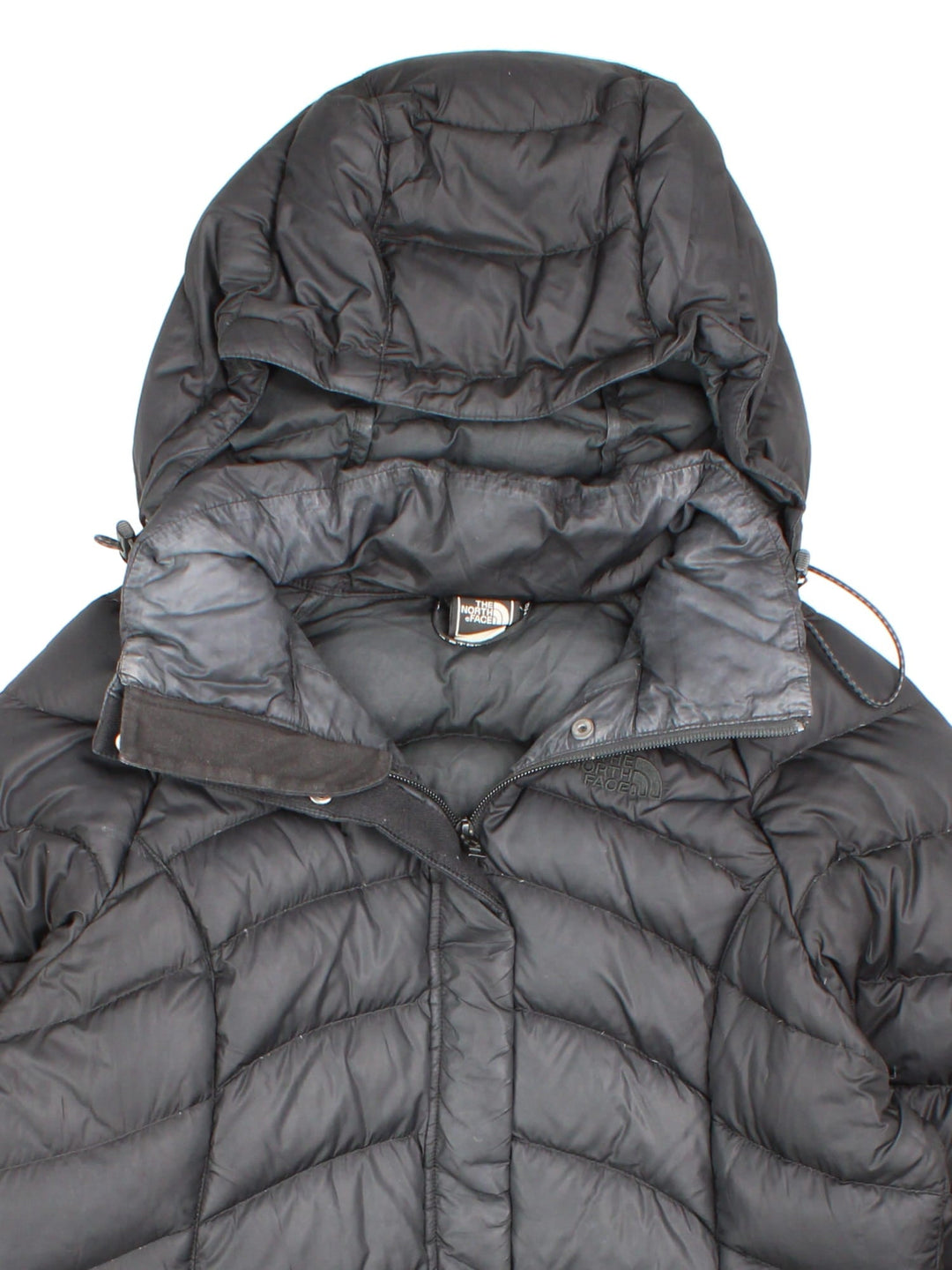 The North Face down filled nano puffer jacket in black with zip and snap closure, two zipped pockets, and embroidered logos front and back.