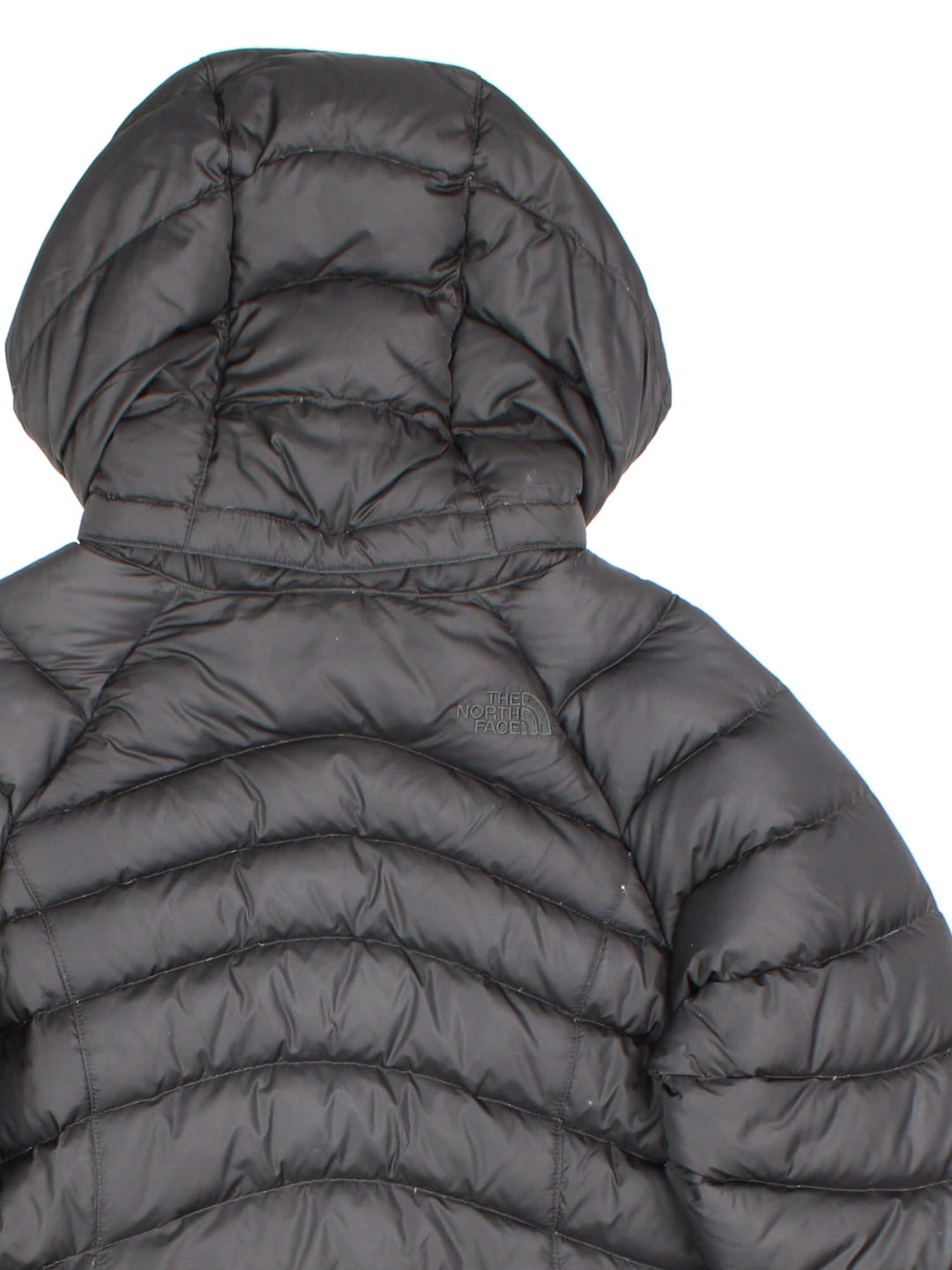 The North Face down filled nano puffer jacket in black with zip and snap closure, two zipped pockets, and embroidered logos front and back.