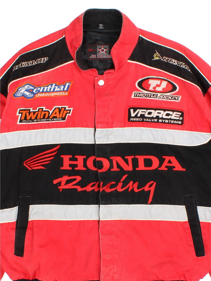 Vintage Honda Nascar Jacket in a red and black colourway. Buttons up and has side pockets, nylon lining, and has the logos and sponsors embroidered all over the front and back.