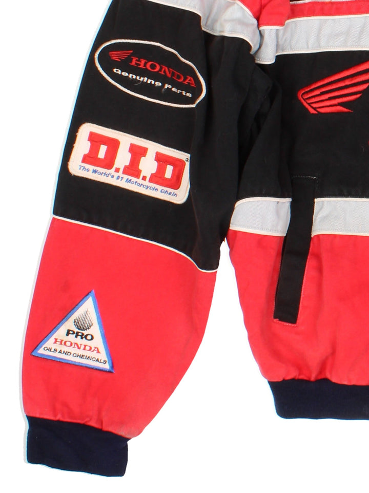 Vintage Honda Nascar Jacket in a red and black colourway. Buttons up and has side pockets, nylon lining, and has the logos and sponsors embroidered all over the front and back.