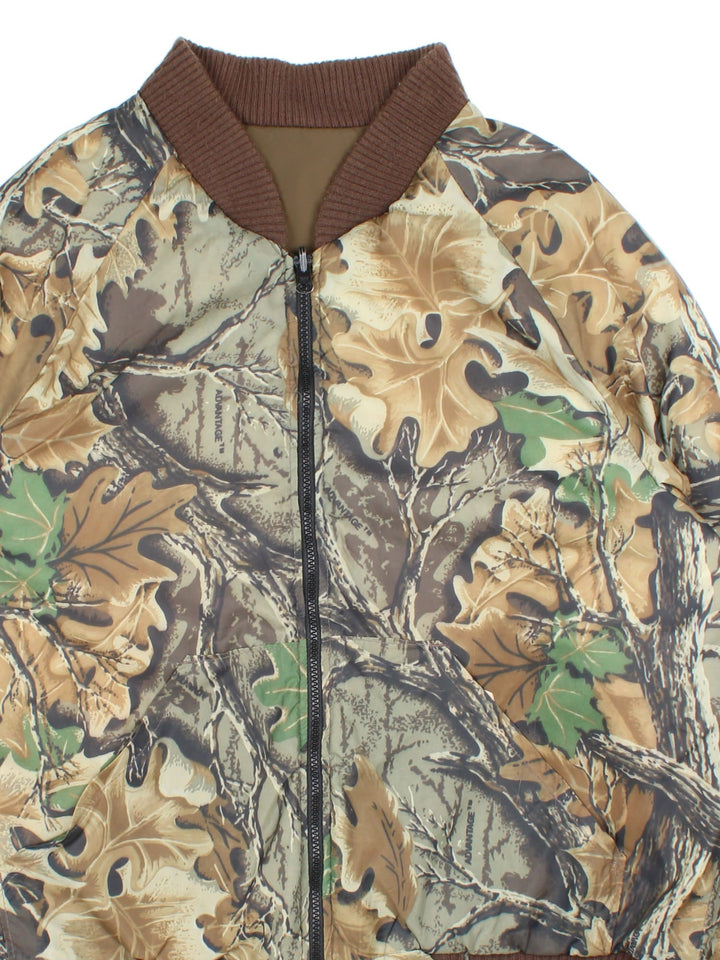 Vintage Real Tree Camo Reversible Bomber Jacket in either a green real tree camo or brown colourway options. Zips up and has side pockets and insulated lining.